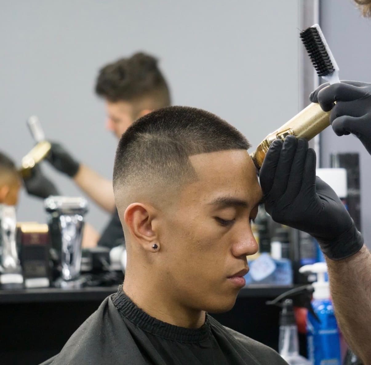 Professional barber precision cutting at Standard Barbershop